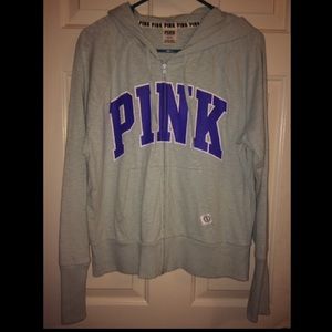 PINK zip-up sweater.